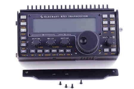 The Elecraft KX3 is shown with the PAE-Kx31 heatsink along with the parts it replaces.