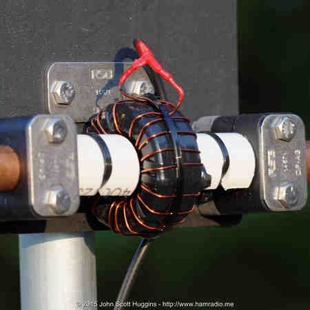 HF small loop antenna feed point featuring 20+ to 1 transformer to yield 50 ohm impedance to coaxial cable.