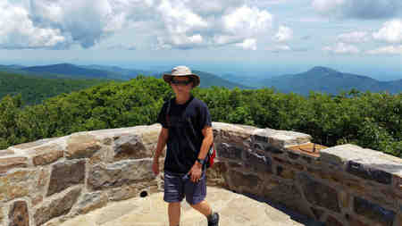 Dylan explores the top of Hawksbill Mountain.