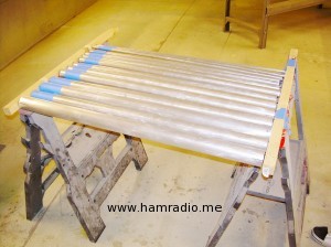 Sanded and masked aluminum pipes ready to prime.