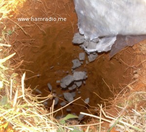 KJ4FAJ pours gravel into hole.