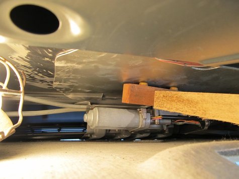 The plate is now in place at the correct location, being held in place by a lever arrangement