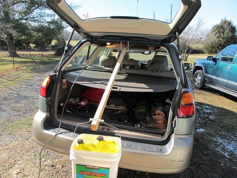 View of the 'lever arrangement'; a fulcrum, stick, and bucket with two jugs
