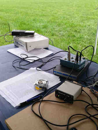 Field Day operating position featuring an Icom IC-2AT and AEA PK-88 for NTS messages.