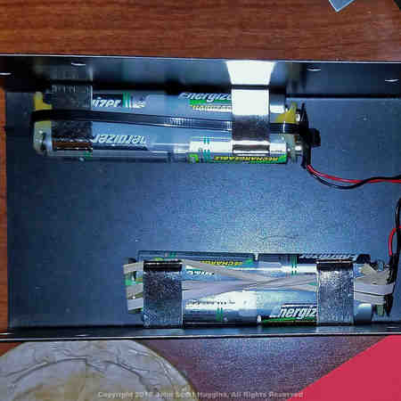 The MFJ-259 SWR Analyzer battery holders.