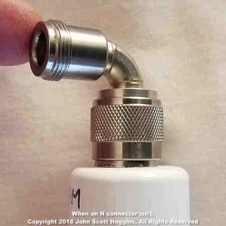 The N elbow bottoms out on the antenna's N connector shoulder preventing a tight seal on the inner connection interface. The elbow spins freely despite connector tightness. The N elbow bottoms out on the antenna's N connector shoulder preventing a tight seal on the inner connection interface. The elbow spins freely despite connector tightness.